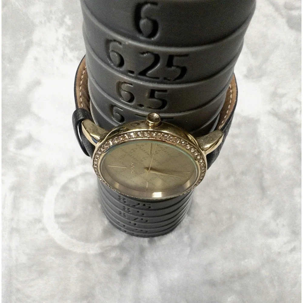 DKNY 111007 Gold Tone All Over Logo Womens 43mm Wristwatch Gem Set Bezel